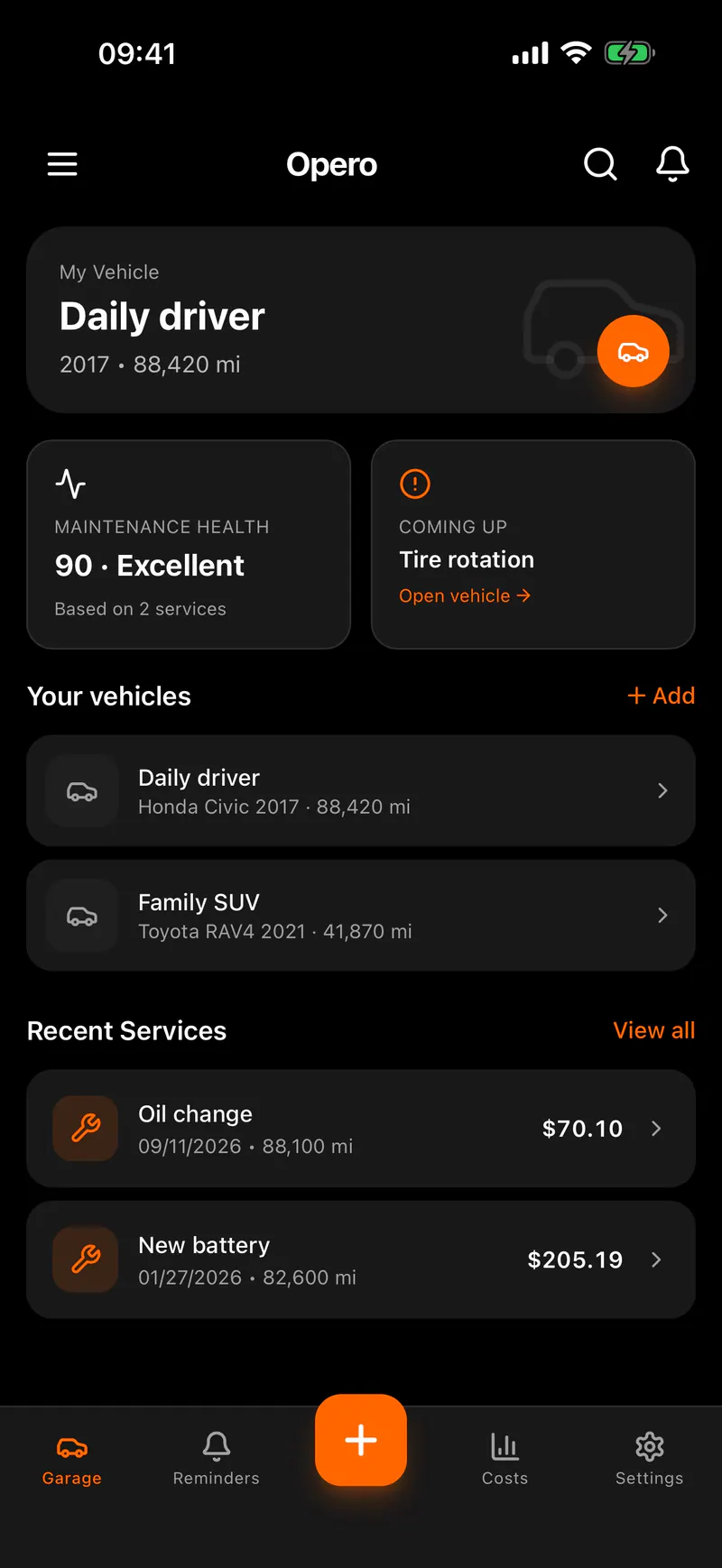 Opero open on a phone, showing the vehicles in your garage and recent services.
